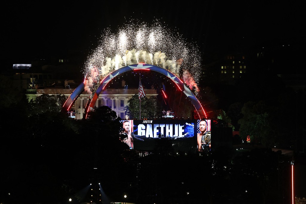 Fireworks shoot into the air over UFC Freedom 250 as America's mixed martial artist Justin Gaethje walks out of the White House for a lightweight title bout against Georgia-Spain's mixed martial artist Ilia Topuria on the South Lawn of the White House, in Washington, DC, on June 14, 2026. (AFP)