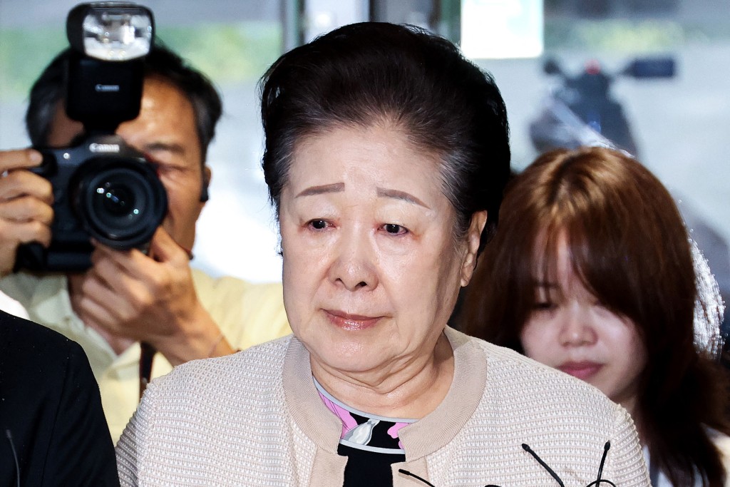 The leader of the Unification Church, Han Hak-ja, arrives at a special prosecutor's office in Seoul on September 17, 2025. (Photo by YONHAP / AFP)