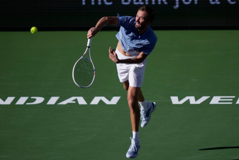 Daniil Medvedev serves against Carlos Alcaraz during their semi-final match. REUTERS