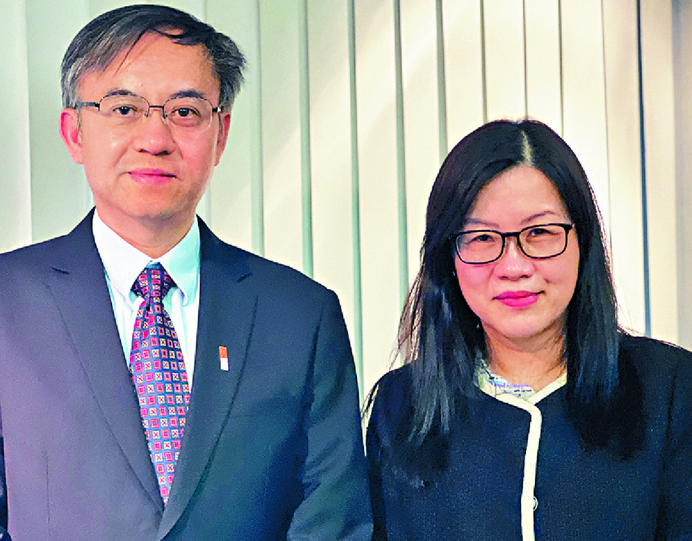 Billy Mak with Housing Department assistant director for finance Grace Chan. sTACY SHI Billy Mak with Housing Department assistant director for finance Grace Chan. sTACY SHI