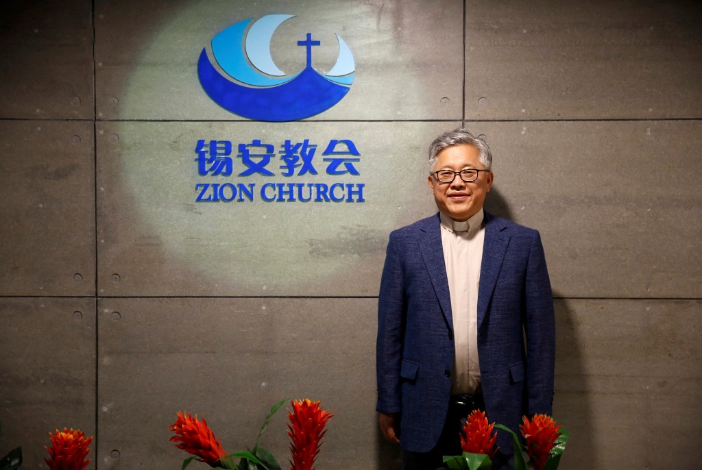  The head pastor of the Zion church in Beijing Jin Mingri poses for picures in the lobby of the unofficial Protestant "house" church in Beijing, China, August 28, 2018. (Reuters)