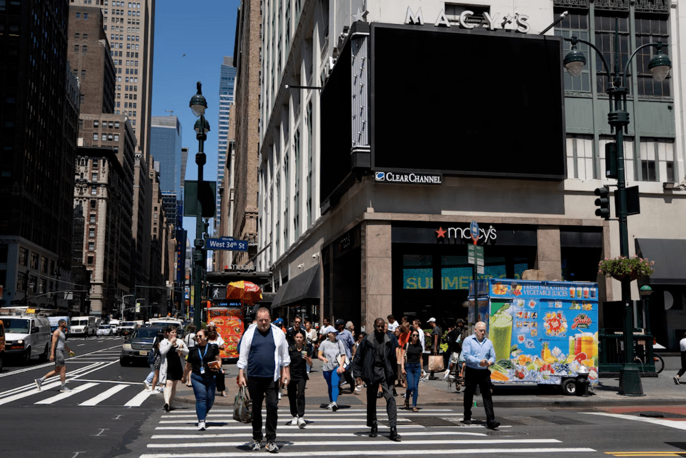 People walk next to blacked out digital billboards at Macy's Herald Square following a global IT outage, in New York City, U.S. July 19, 2024. REUTERS/David 'Dee' Delgado People walk next to blacked out digital billboards at Macy's Herald Square following a global IT outage, in New York City, U.S. July 19, 2024. REUTERS/David 'Dee' Delgado