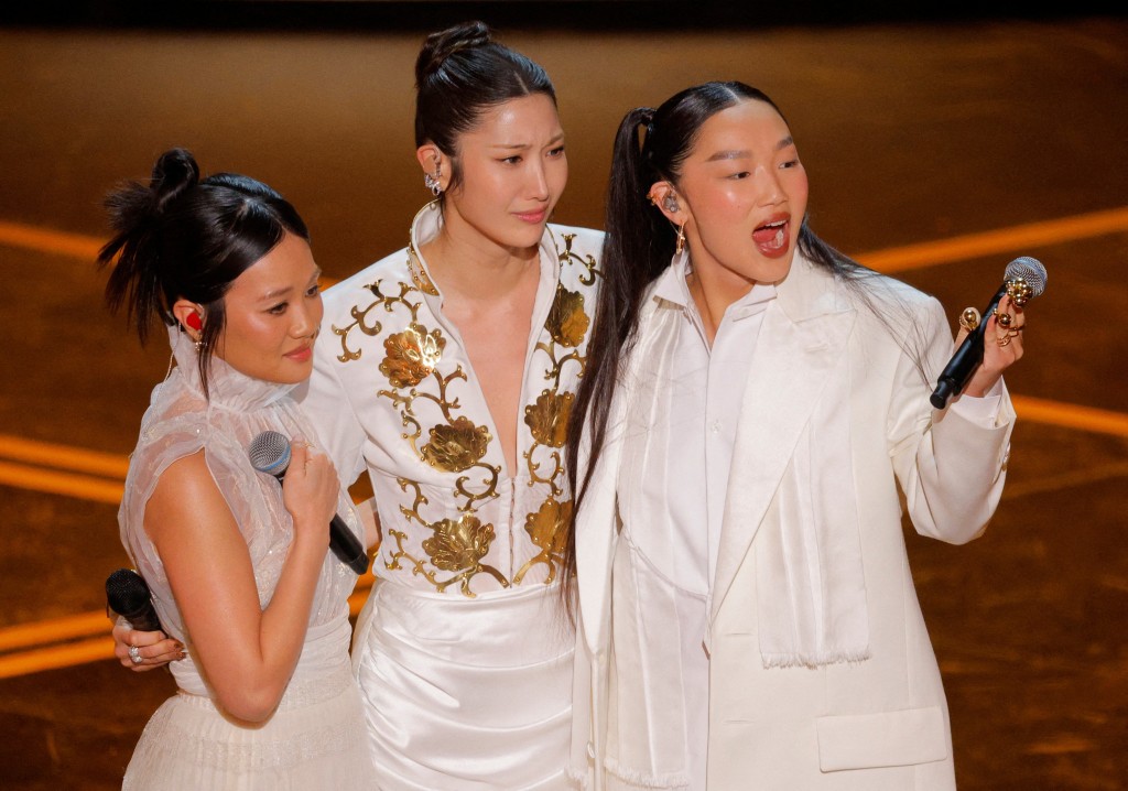 Rei Ami, EJAE, and Audrey Nuna from KPop Demon Hunters react as they perform on stage during the Oscars show at the 98th Academy Awards in Hollywood, Los Angeles, California, U.S., March 15, 2026. (Reuters)