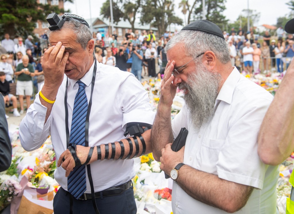 Israel's ambassador to Australia, Amir Maimon, prays during his visit to the floral tribute at Bondi Beach to honour the victims of a mass shooting targeting a Hanukkah celebration on Sunday at Bondi Beach, in Sydney, Australia, December 16, 2025. REUTERS/Jeremy Piper