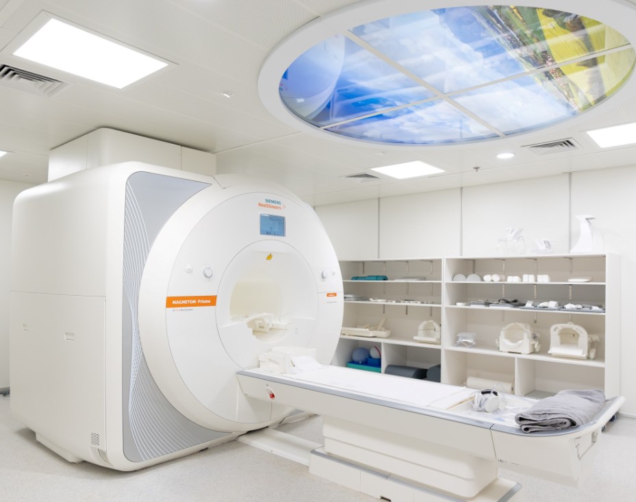 Alexander Wai and Clement Chen, center left, at the opening ceremony. Above: an MRI scanner. Alexander Wai and Clement Chen, center left, at the opening ceremony. Above: an MRI scanner.