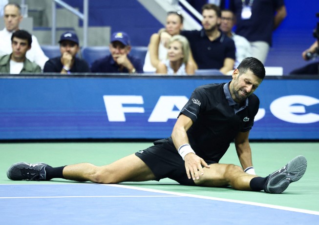Novak Djokovic suffers during his US Open first-round defeat by Mariano Navone. AFP