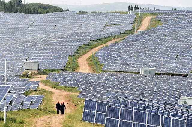 Solar panels are seen at a solar power plant in Pingdingshan, Henan province, China June 7, 2018. Picture taken June 7, 2018. REUTERS/Stringer/File Photo