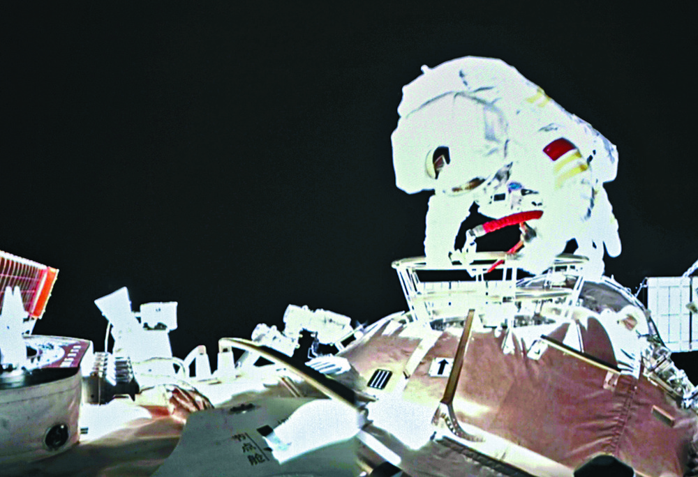 Wang Yaping conducts activities outside the space station's Tianhe core module, left, and with Ye Guangfu and Zhai Zhigang at the launch ceremony last month. agencies Wang Yaping conducts activities outside the space station's Tianhe core module, left, and with Ye Guangfu and Zhai Zhigang at the launch ceremony last month. agencies