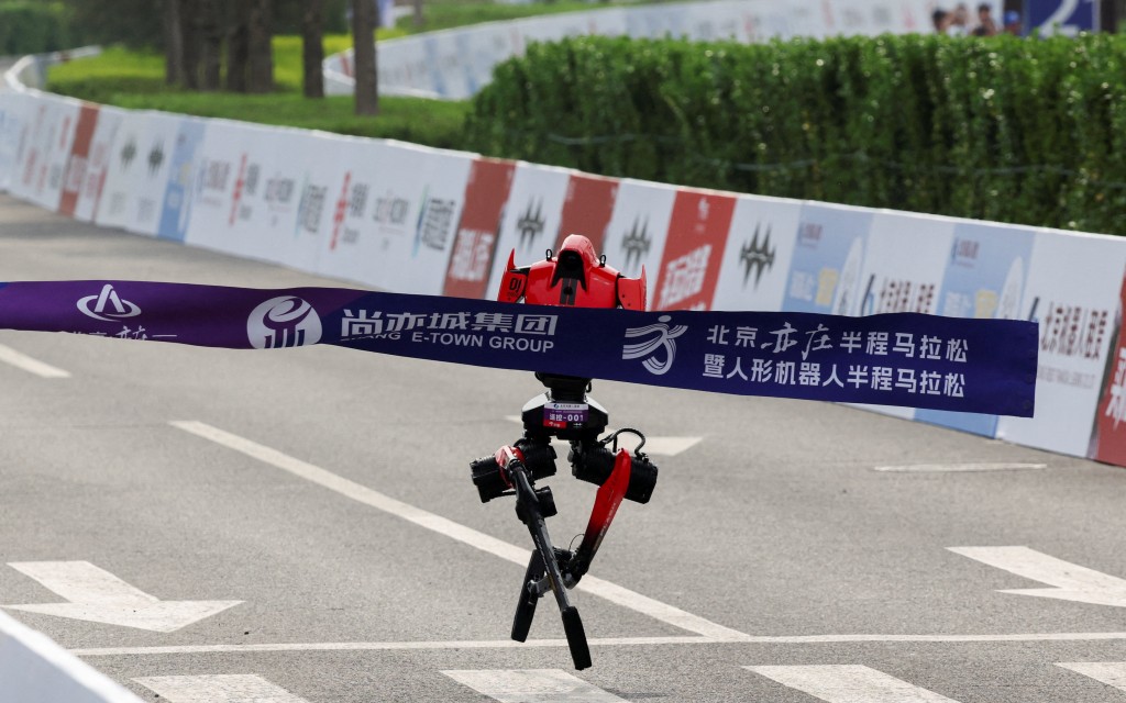 An Honor Lightning humanoid robot reaches the finish line during the second Beijing E-Town Half Marathon and Humanoid Robot Half Marathon in Beijing, China April 19, 2026. (Reuters)