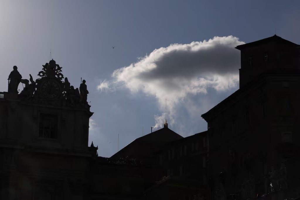 White smoke rises from the chimney on the Sistine Chapel, indicating that a new pope has been elected at the Vatican, May 8, 2025. (Reuters)