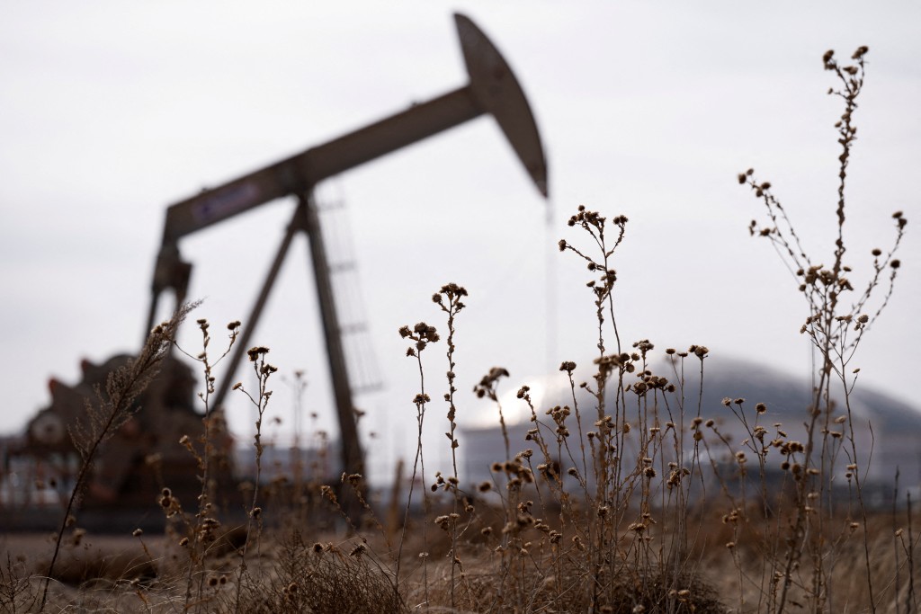 A pump jack operates near a crude oil reserve in the Permian Basin oil field near Midland, Texas, U.S. (File)