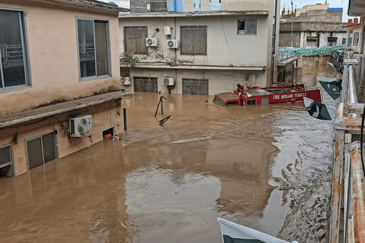 A firefighting department vehicle submerged in a floodwater following flash flooding due to heavy rains in the neighbourhood of Mingora, the main town of Swat Valley, northwestern Pakistan, Friday, Aug. 15, 2025. (AP Photo/Sherin Zada)