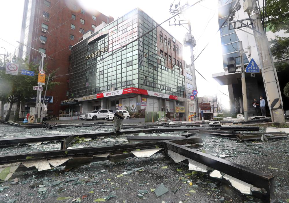 Debris from a damaged hospital caused by typhoon is seen on a street in Ulsan, South Korea. (AP) Debris from a damaged hospital caused by typhoon is seen on a street in Ulsan, South Korea. (AP)
