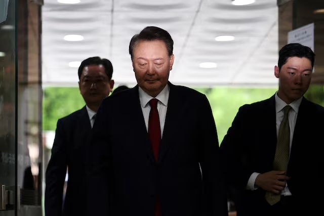 Former South Korean President Yoon Suk Yeol arrives at a court to attend a hearing to review his arrest warrant requested by special prosecutors in Seoul, South Korea, July 9, 2025. REUTERS/Kim Hong-Ji/Pool/File Photo 