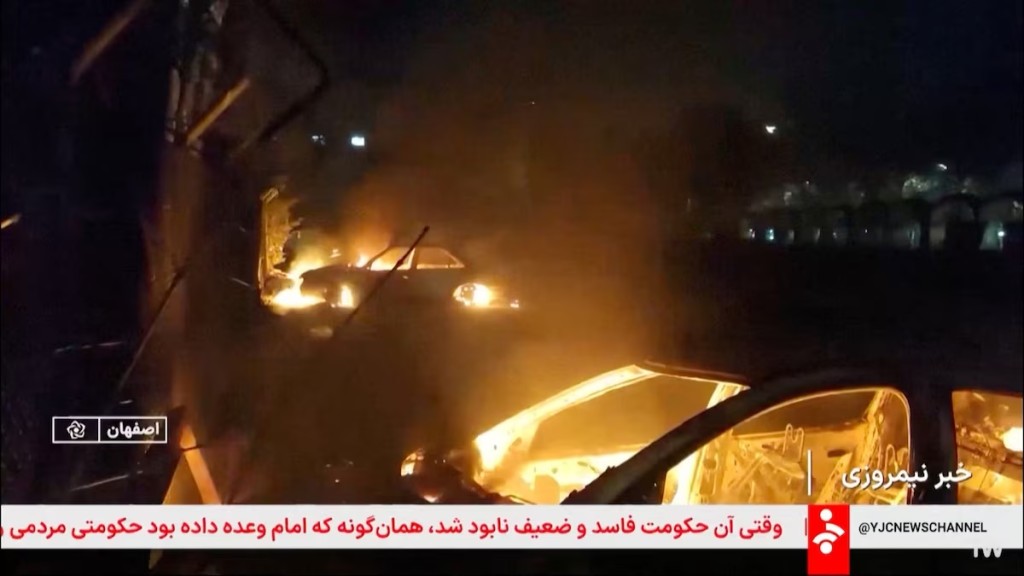 Flames engulf cars following unrest sparked by dire economic conditions, in a place given as Isfahan, Iran, January 9, 2026, in this screengrab from Iran's state media broadcast footage. IRIB via WANA(West Asia News Agency) via REUTERS