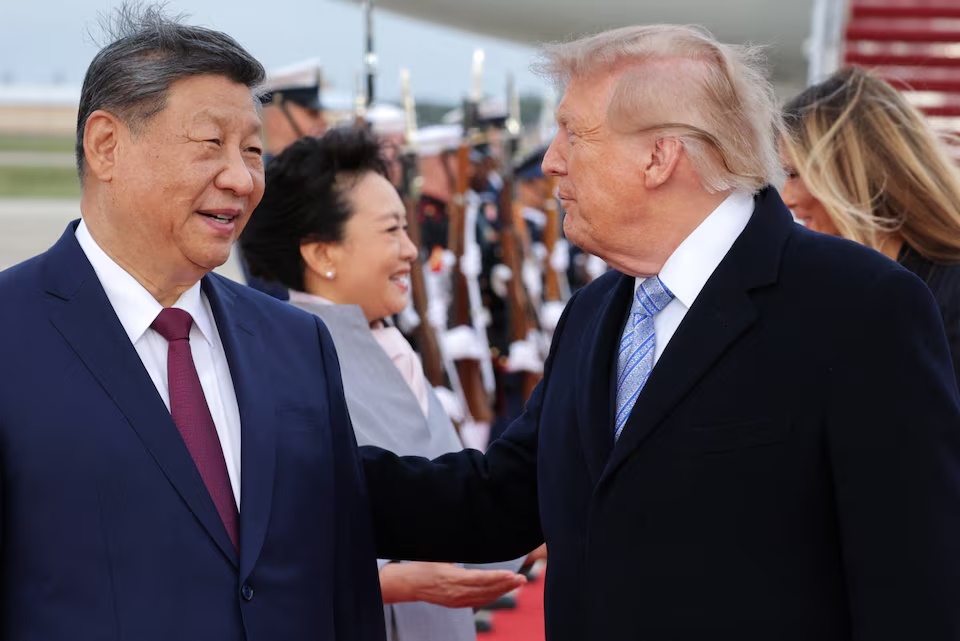 US President Donald Trump and Chinese President Xi Jinping speak as Xi arrives ahead of a state visit at Joint Base Andrews, Maryland, US, September 23, 2026. REUTERS/Jonathan Ernst