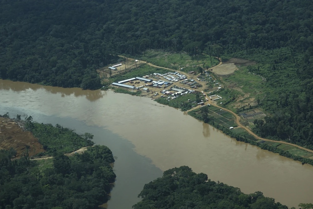 Discoloration is visible in a river near mining operations at the Muchacha mine in September 2022, near the Okapi Wildlife Reserve in Congo. (AP Photo)