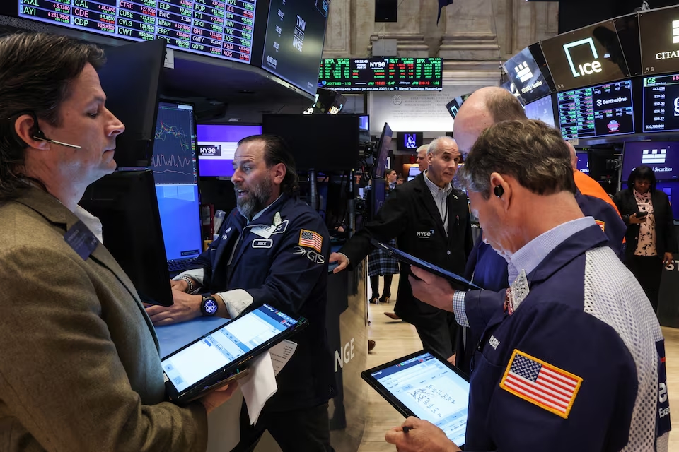 Traders work on the floor at the New York Stock Exchange (NYSE) in New York City, U.S., April 14, 2025. (Reuters)