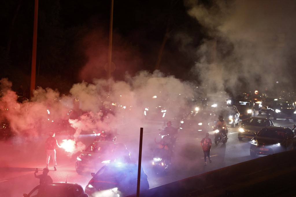 PSG supporters celebrate their team's win in the UEFA Champions League final between Paris Saint-Germain (PSG) and Arsenal FC played in Budapest, in Paris on May 30, 2026. (AFP)