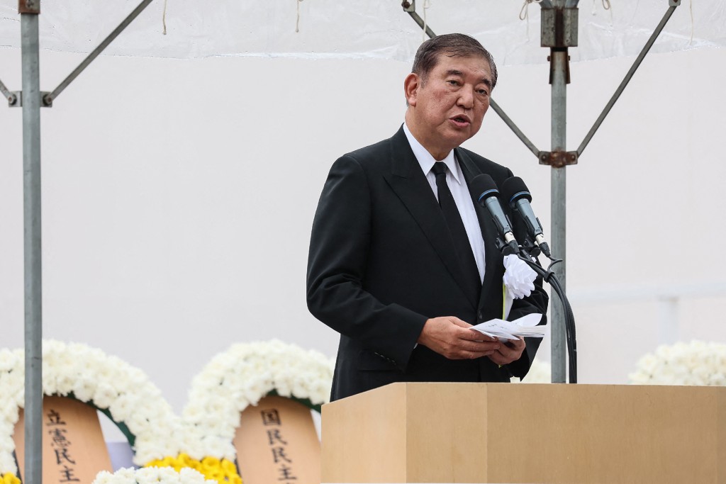 Japan's Prime Minister Shigeru Ishiba gives a speech during the annual memorial ceremony for the victims at the Peace Park in Nagasaki on August 9, 2025, to mark the 80th anniversary of the atomic bombing during WWII. (Photo by JIJI PRESS / AFP)