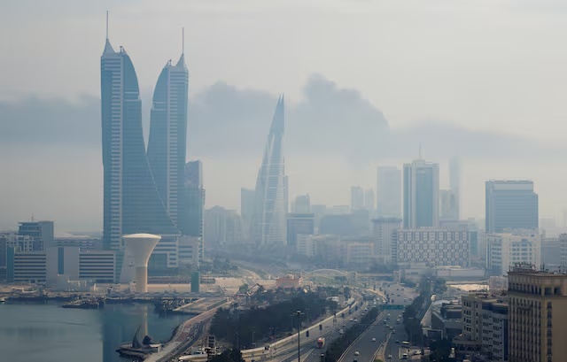 Smoke rises following a reported Iranian drone strike on the fuel storage facility of Bahrain International Airport, amid the U.S.-Israeli conflict with Iran, in Muharraq, Manama, Bahrain, March 12, 2026. REUTERS/Stringer