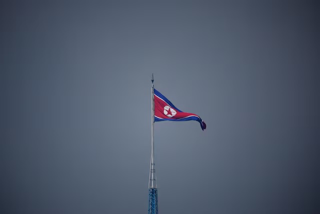 A North Korean flag flutters at the propaganda village of Gijungdong in North Korea, in this picture taken near the truce village of Panmunjom inside the demilitarized zone (DMZ) separating the two Koreas, South Korea, July 19, 2022. REUTERS/Kim Hong-Ji/Pool