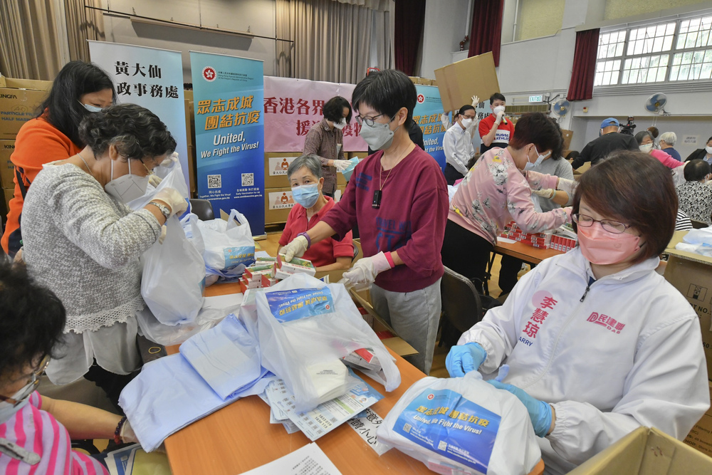 The DAB helps prepare the service bags. SING TAO The DAB helps prepare the service bags. SING TAO