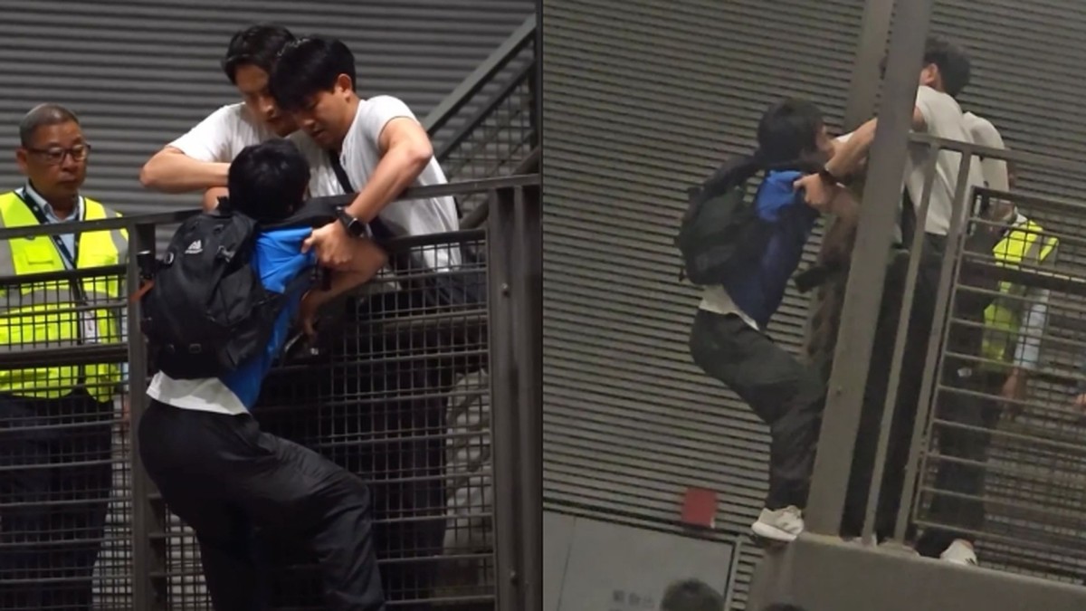 (Video) Fan climbs over railing at airport to catch glimpse of K-pop ...