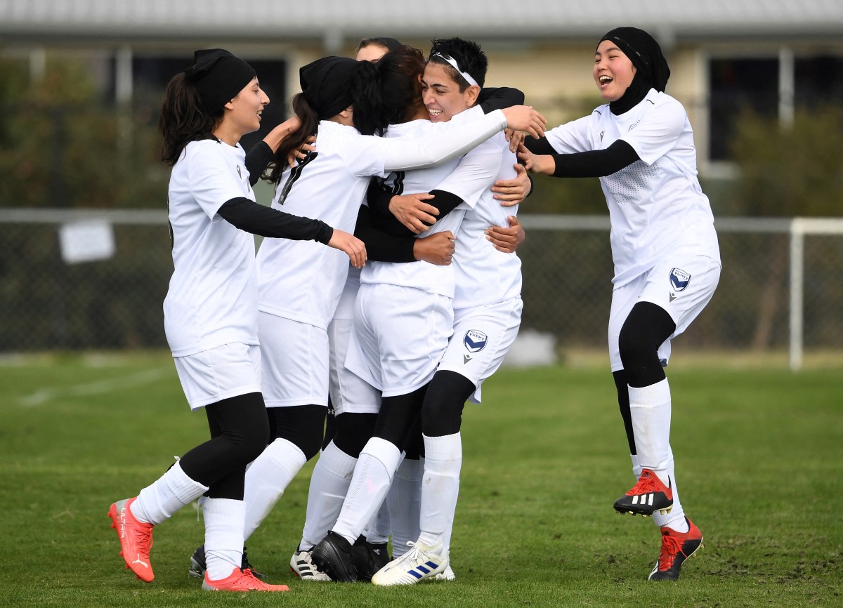 Afghan women footballers celebrate 'historical moment'