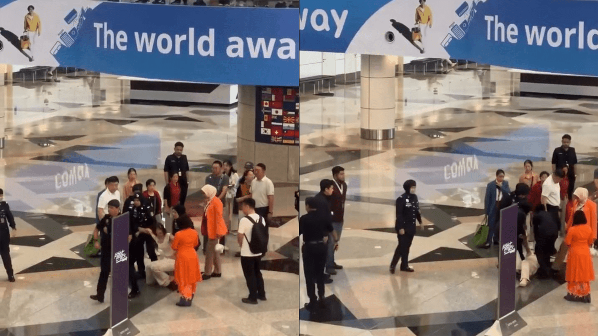 （视频）中国游客试图冲破限制门后被带离吉隆坡机场