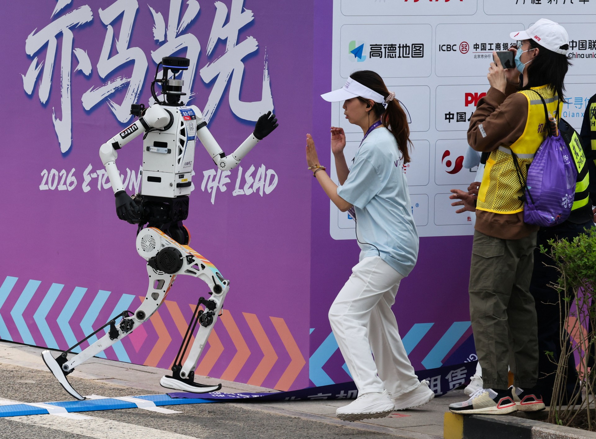 Humanoid robots race past humans in Beijing half-marathon, showing ...